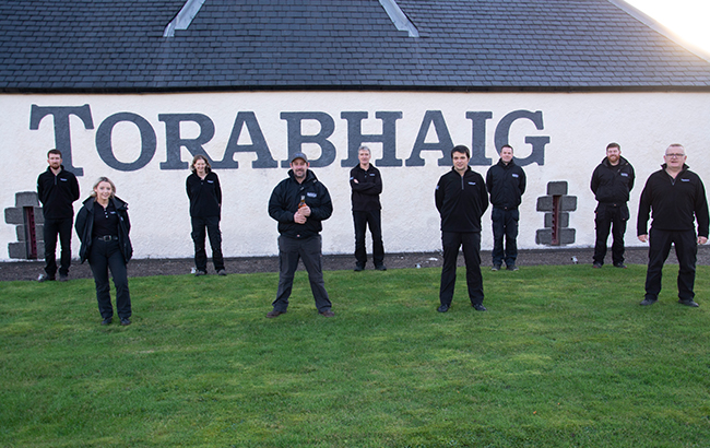 The two bottles been signed by all nine Torabhaig distillers