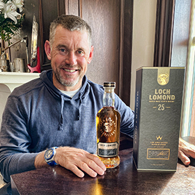 Golfer Lee Westwood with the 25yo Loch Lomond whisky