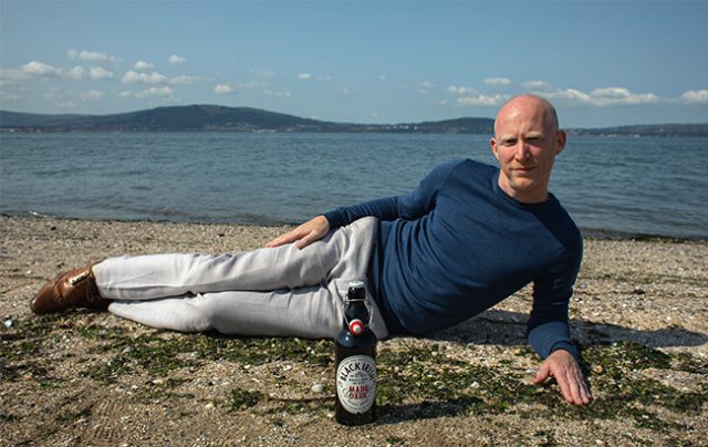 Richard Ryan, founder of Black Irish, mimics Carey's pose promoting her cream liqueur bottlings