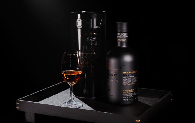 Bruichladdich Black Art whisky bottle and glass on a tray
