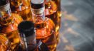 Bottles of strong liquors in production