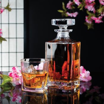 Japanese Whisky in a stylish bottle with Sakura Cherry Blossoms in an atmospheric Ambience