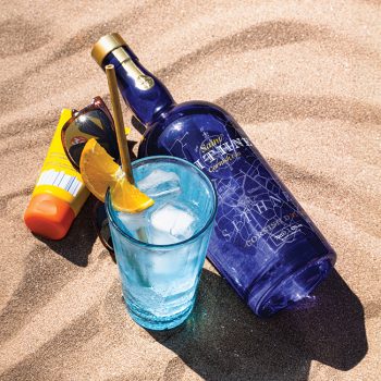 Saint Sithney Gin bottle on sand
