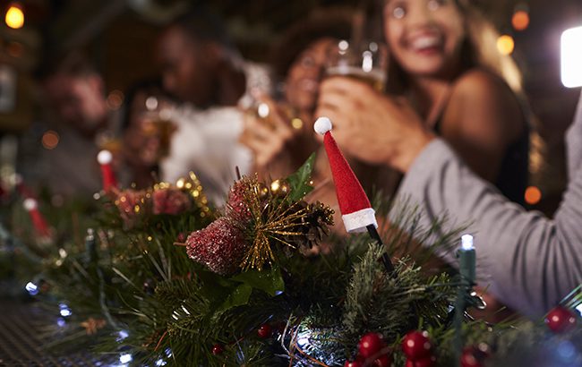 Christmas party at a bar, focus on foreground decorations