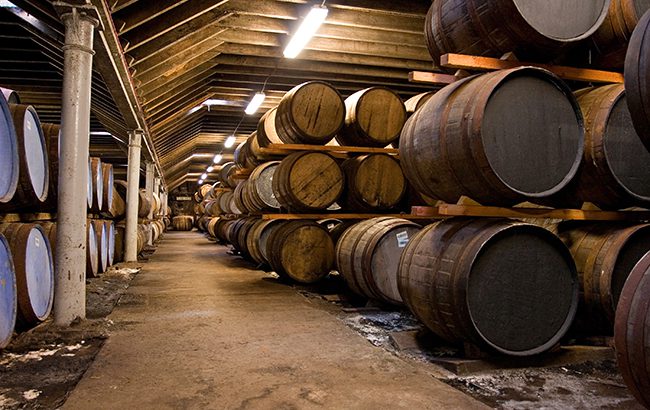 warehousing: Wooden whisky barrels in a famous scottish distillery.