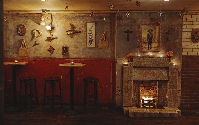 Cinco’s interiors feature bare brickwork and Mexican artwork collected by its co-founders