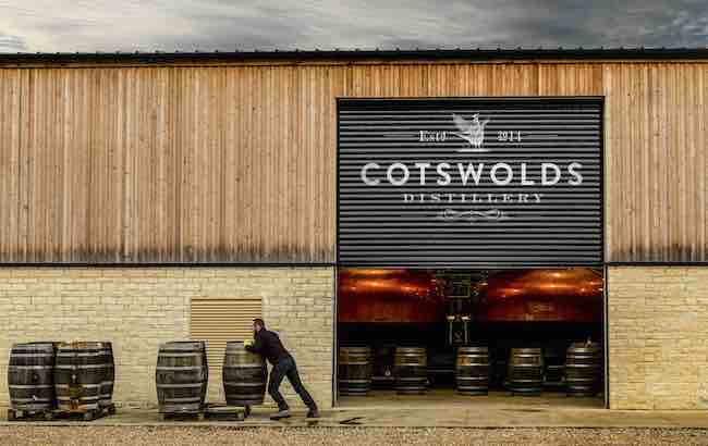 A man moves barrels outside a distillery. Distilleries will be offering tour deals and special events during English whisky week.