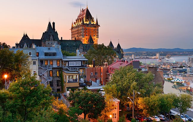 Quebec City skyline with Chateau Frontenac at sunset viewed from hill