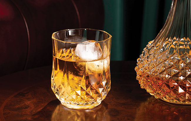 crystal glass with Scotch in the lobby of the hotel