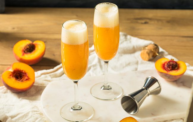 Refreshing Boozy festive Peach Bellini Cocktail with Prosecco