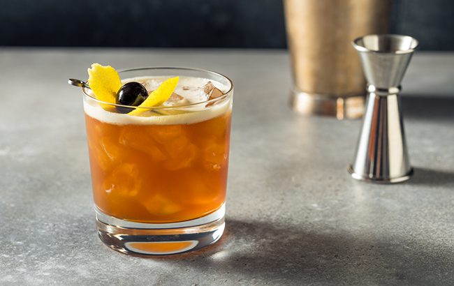 Boozy Refreshing Cold Amaretto Sour Cocktail with Lemon