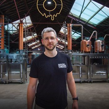 DropWorks Distillery Lewis - Founder in front of stills Distillery Shoot-27