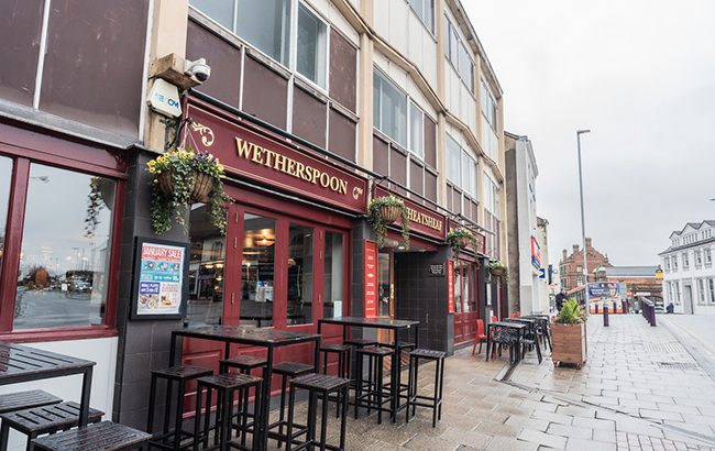Wetherspoon Pub With Outdoor Seating In The Foreground